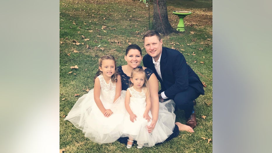 Ashley Gunter poses for a family photo
