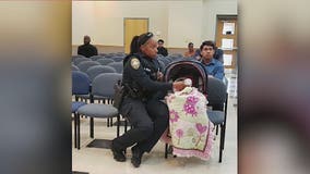 Georgia police officer helps mother with infant in traffic court