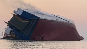 Overturned ship's fuel tanks drained of 320,000 gallons