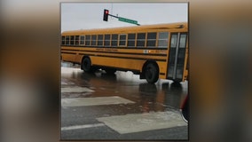 Yellow bus slides sideways down Minnesota road