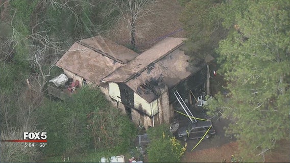 Firefighters pull man from burning Lilburn home