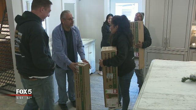 Kennesaw company donates Christmas trees to families