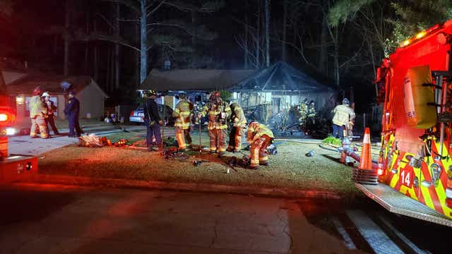 3 rushed to the hospital after a fire rips through front of Lithonia-area home