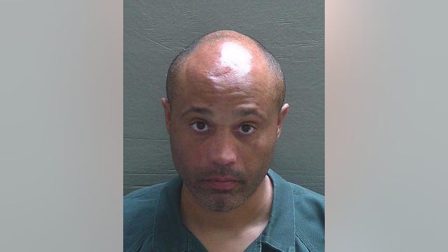 Man charged with throwing pit bull from bridge