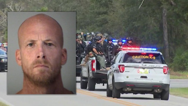 Sheriff: 'Armed and dangerous' man who shot police officer killed by SWAT team