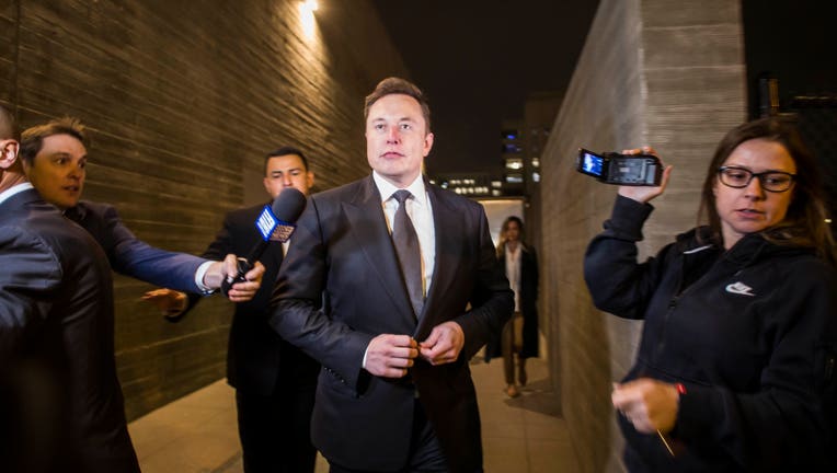 LOS ANGELES, CA - DECEMBER 03: Elon Musk, chief executive officer of Tesla Inc. leaves the US District Court, Central District of California through a back door in Los Angeles, U.S. on December 3, 2019 in Los Angeles, California. The defamation lawsuit against Tesla CEO Elon Musk began in Los Angeles over calling British cave explorer Vernon Unsworth 