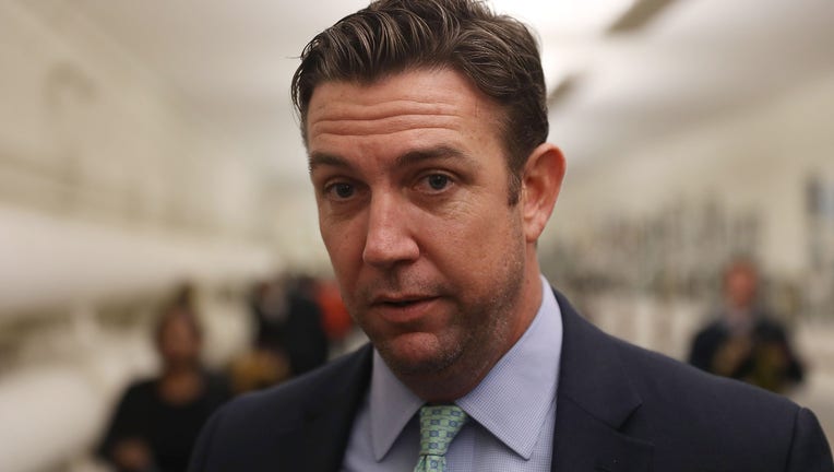 WASHINGTON, DC - JANUARY 10: Rep. Duncan Hunter (R-CA) speaks to the media before a painting he found offensive and removed is rehung on the U.S. Capitol walls on January 10, 2017 in Washington, DC. The painting is part of a larger art show hanging in the Capitol and is by a recent high school graduate, David Pulphus, and depicts his interpretation of civil unrest in and around the 2014 events in Ferguson, Missouri. (Photo by Joe Raedle/Getty Images)