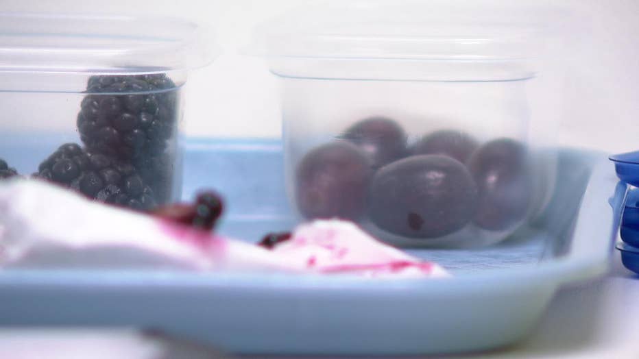 Containers of raspberries, blackberries and grapes