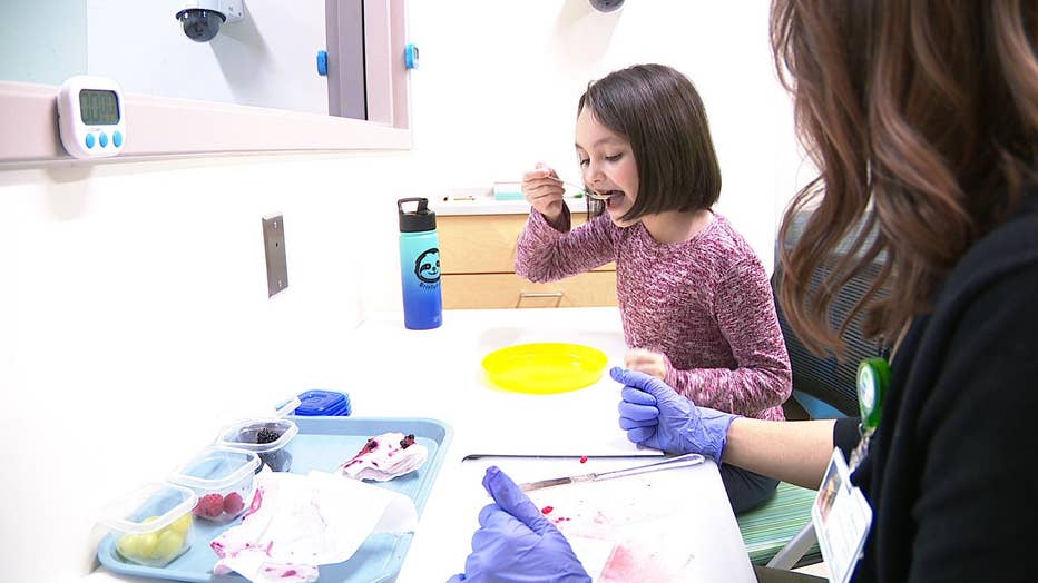 Girl eats berries at Children's Healthcare of Atlanta