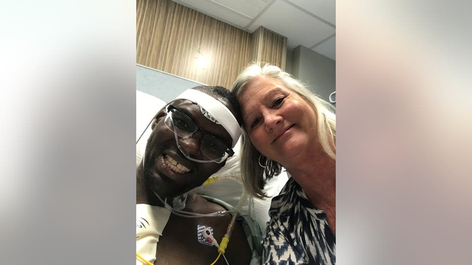 Jonathan Pinkard smiles in hospital bed