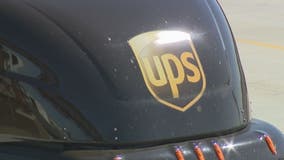 UPS deftly navigates shipping surge, hit by pension charge