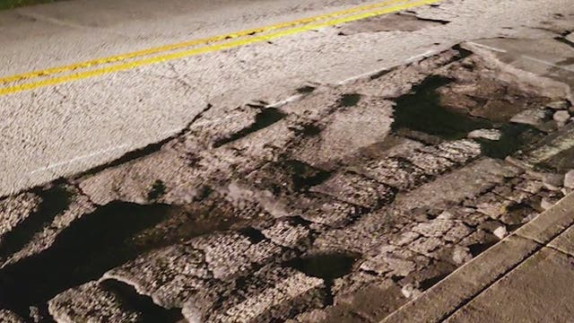 Vehicles damages after hitting large potholes in DeKalb County