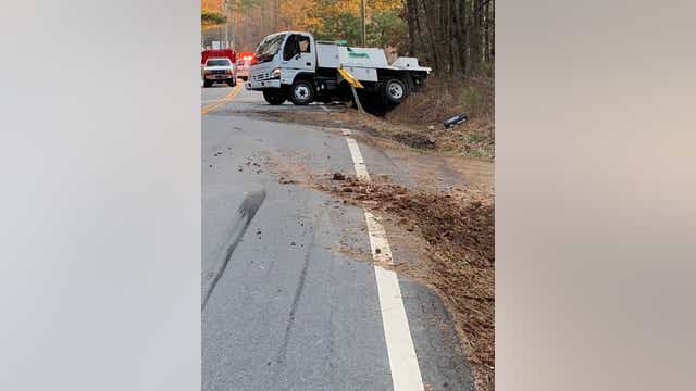 Truck overturns, spills hundreds of gallons of lawn chemical onto roadway