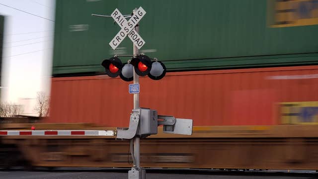 Officer hit by train while chasing burglary suspect on foot