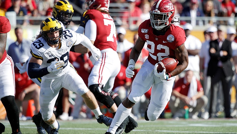 ORLANDO, FL - JANUARY 01: Najee Harris #22 of the Alabama Crimson Tide heads for the end zone on a nine-yard touchdown run against the Michigan Wolverines in the second quarter of the Vrbo Citrus Bowl at Camping World Stadium on January 1, 2020 in Orlando, Florida. (Photo by Joe Robbins/Getty Images)