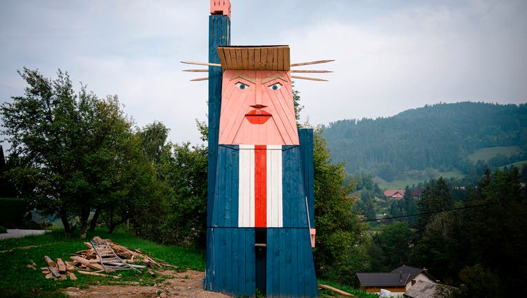 FILE - A wooden structure made to resemble US President Donald Trump is constructed in the village of Sela pri Kamniku, about 20 miles northeast of Ljubljana in Slovenia, the home country of Trump's wife on August 28, 2019.