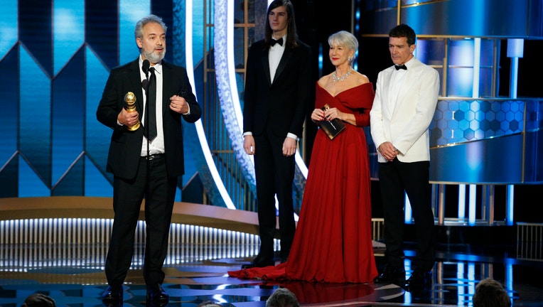 BEVERLY HILLS, CALIFORNIA - JANUARY 05: In this handout photo provided by NBCUniversal Media, LLC, Sam Mendes accepts the award for BEST DIRECTOR - MOTION PICTURE for 