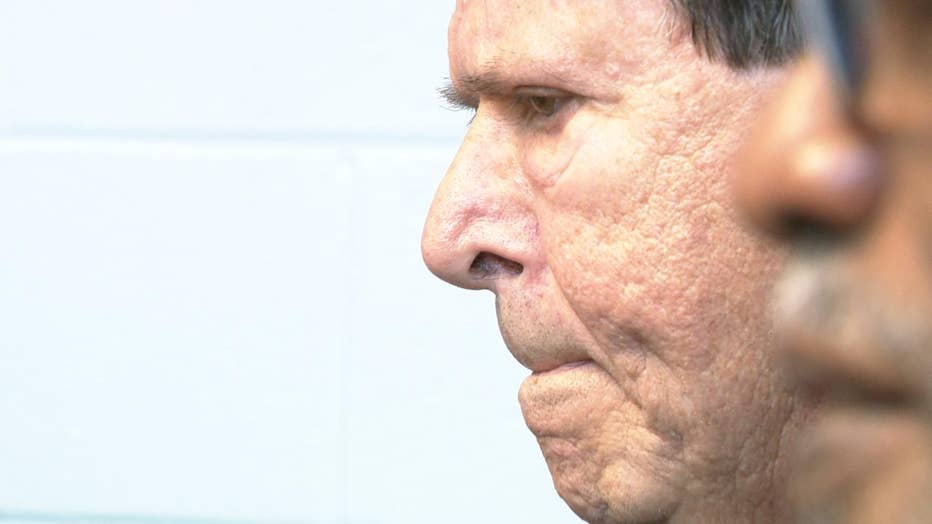 Man concentrates during boxing class.