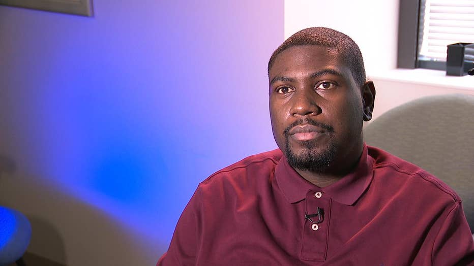 Man sits in front of TV camera