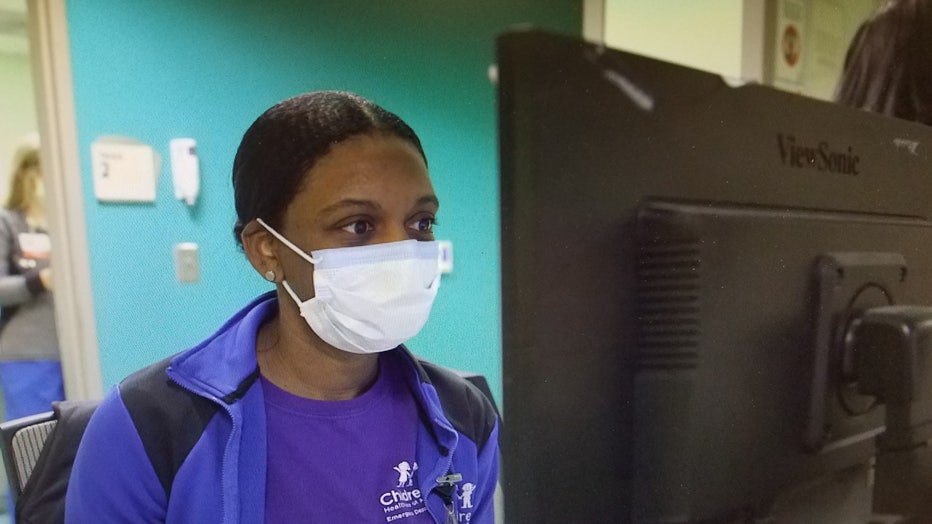 ER nurse wears protective mask during flu season