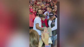 WWII veteran carried to his seat by fellow Trump supporters at Phoenix campaign rally