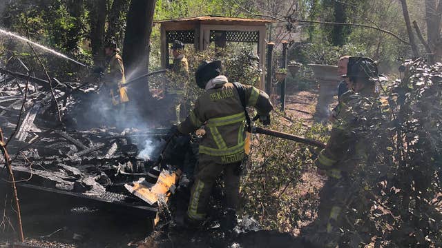 Firefighters battle brush, storage shed fire in DeKalb County
