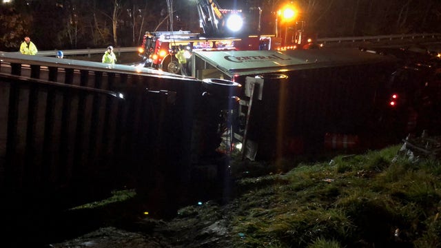 Tractor-trailer rolls over, blocks Spaghetti Junction overnight