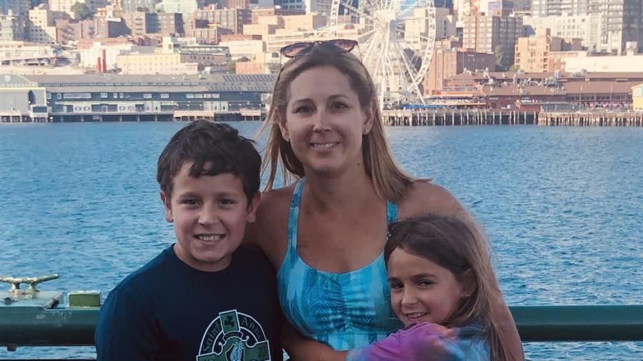 Angie Downs and her children pose along the waterfront.