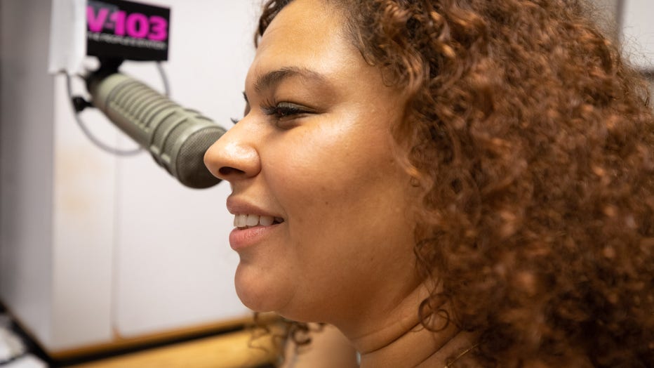 Woman smiles in studio