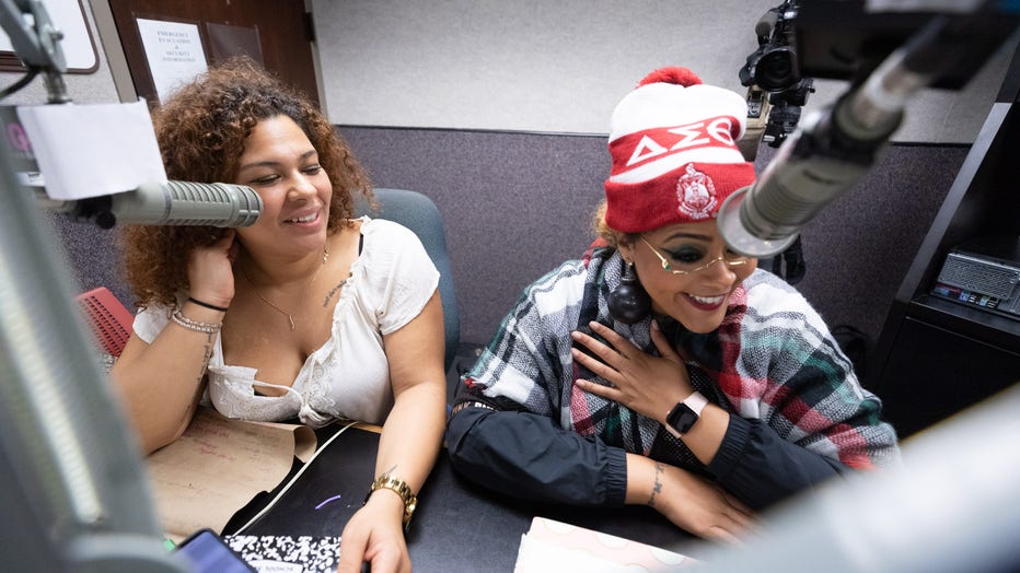 Women sit in recording studio