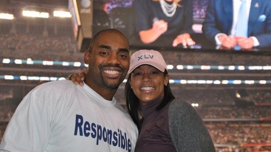 Keasha and Chris Draft at a football game