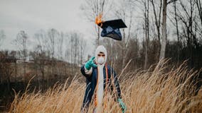 Student dons cap and gown over mask, protective suit in coronavirus-altered graduation photos