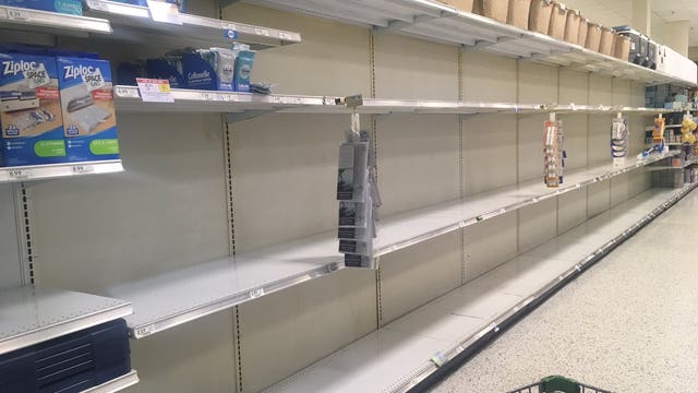 Spreading coronavirus unleashes mad dash to supermarkets, Kemp urges calm