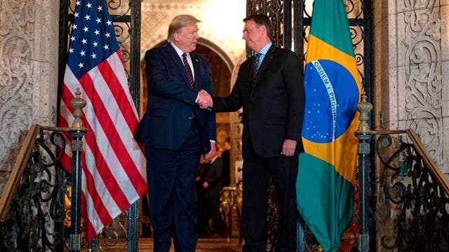 Brazil's President Bolsonaro's son claims father tested negative for coronavirus despite earlier reports