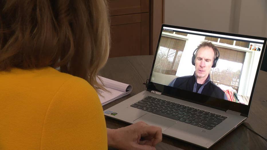 Reporter speaks to man on computer screen via Skype.