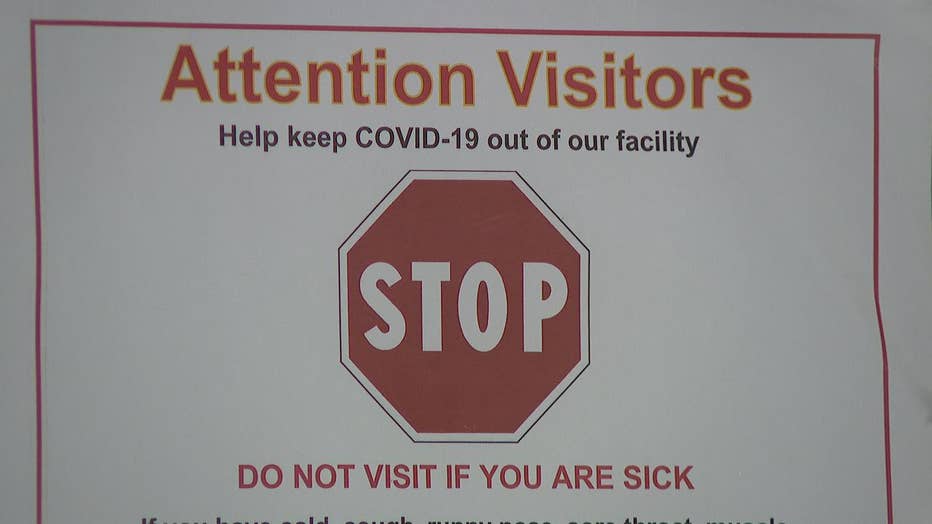 Sign reads: do not visit if you are sick.