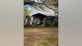 Hall County fire crews work to contain house fire