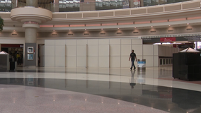 Coronavirus pandemic prompts Atlanta's airport managers to erect temporary walls covering seating