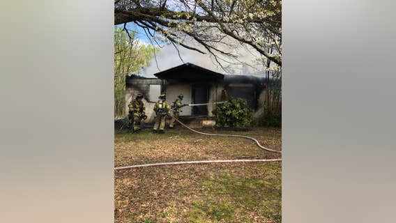 Hall County fire crews work to contain house fire