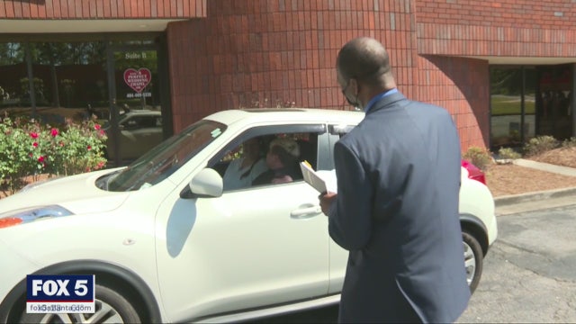 COVID-19 forces Georgia couples to wed in curbside ceremonies