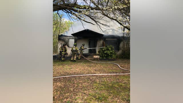 Hall County fire crews work to contain house fire