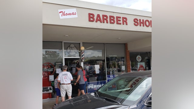 With businesses reopening, customers eager to get a clip at Buckhead barbershop