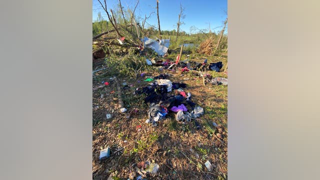 Police officer lays on her children in bathtub as Georgia home is lifted by tornado