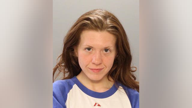 Police: Woman charged after spitting on 2 people in separate incidents