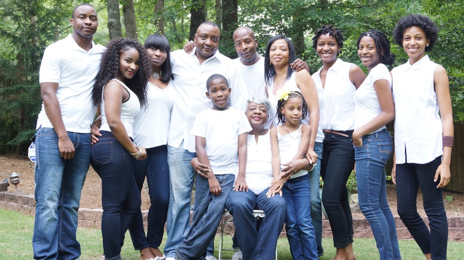 Woman is surrounded by her family