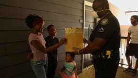 Atlanta police officer uses hazard pay bonus to help students