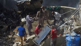 Pakistan jet with 98 aboard crashes in crowded neighborhood