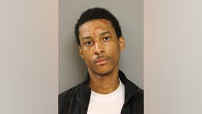 Crowd throws bottles at officers arresting man with gun near triple shooting: police