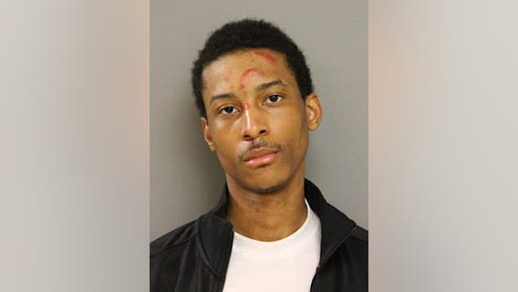 Crowd throws bottles at officers arresting man with gun near triple shooting: police