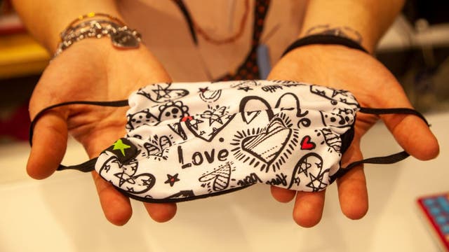 How should I clean and store my face mask?